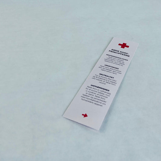 Bogmærke med Røde Kors’ 7 principper